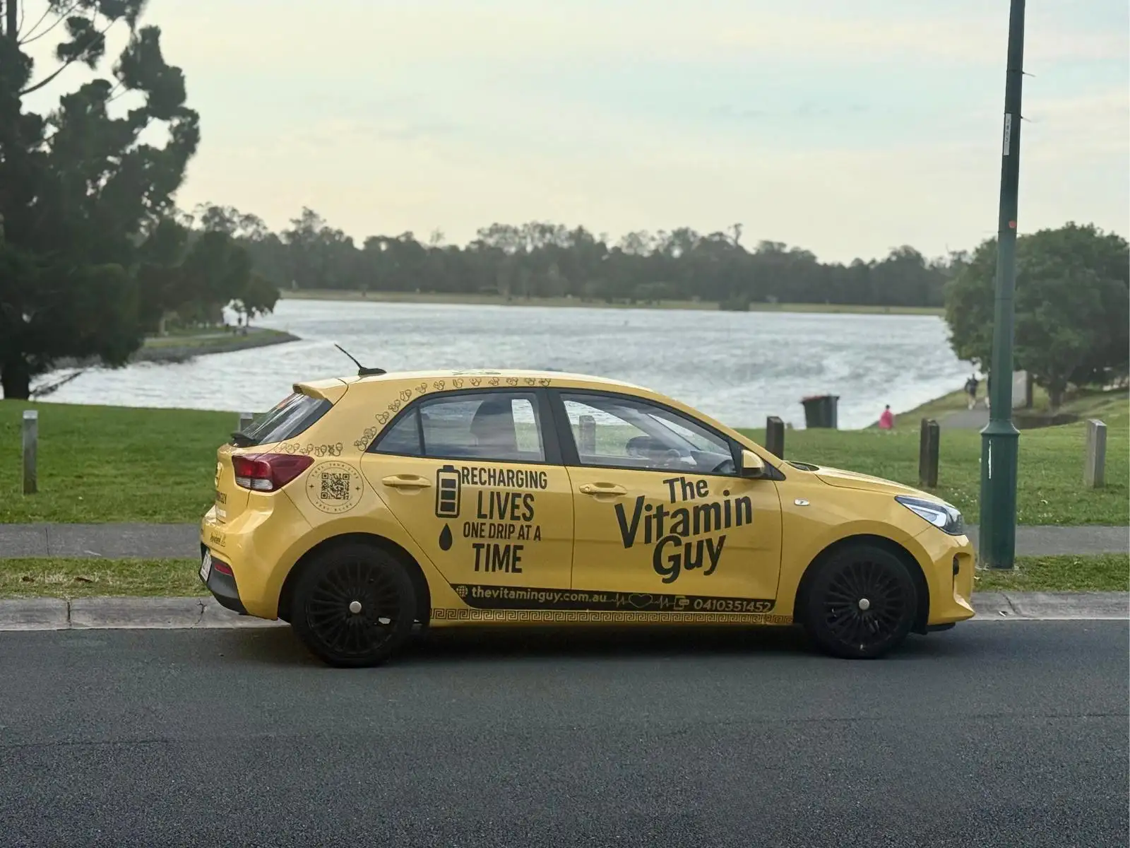 The Vitamin Guy mobile IV car parked by the water, ready for a home or hotel visit