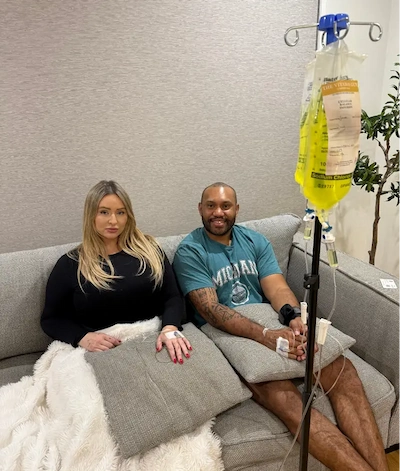 Couple receiving mobile IV vitamin therapy for hangover recovery — Gold Coast