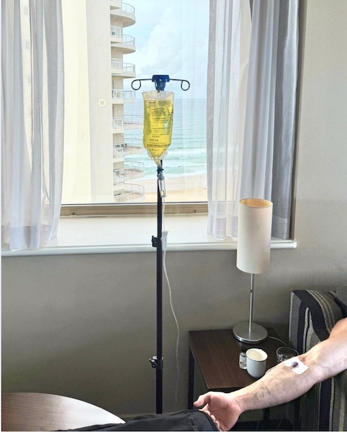 IV therapy administered to a client in a Brisbane hotel room